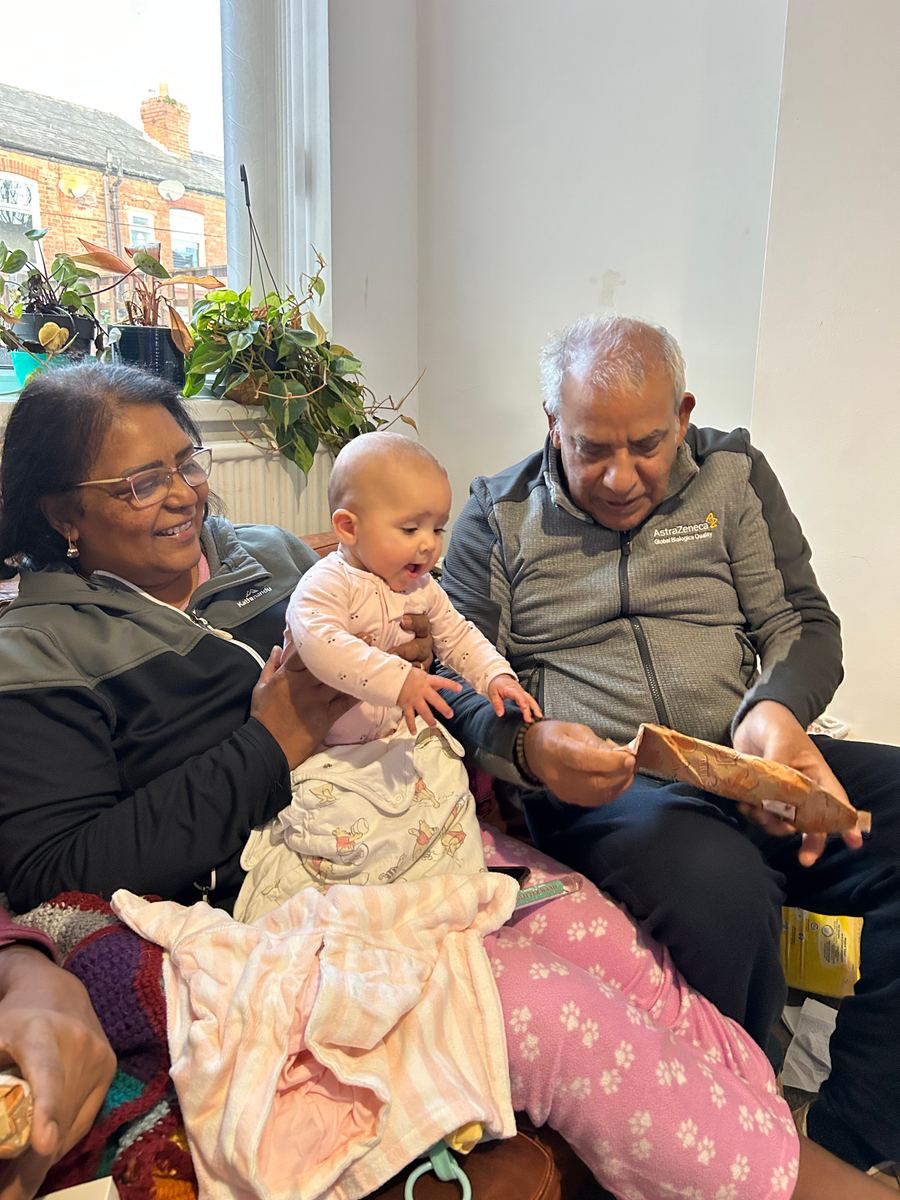 Opening presents together on Emilia’s first Christmas morning. 